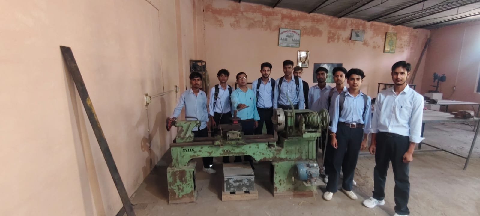 Practical class — trainees with their instructor at the lathe